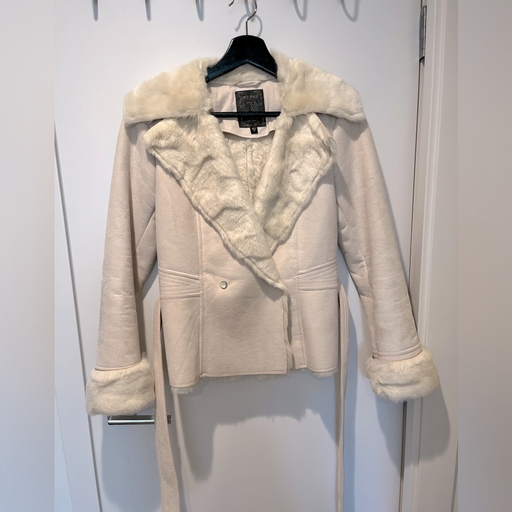 Beige fur coat from Guess. Very soft and cozy. Like new. No odour or damage.